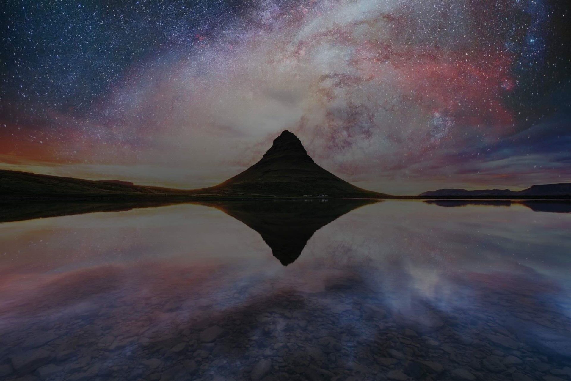 The picturesque sunset over landscapes and waterfalls. Kirkjufell mountain. Courtesy of NASA. Fantastic starry sky and the milky way. Iceland